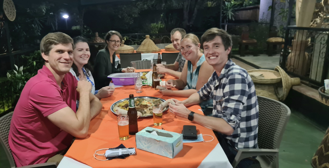Guests sharing a platter on the evening terrace