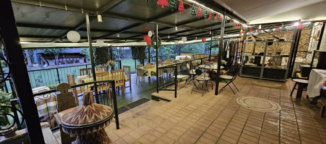 Covered terrace seating decorated with lanterns